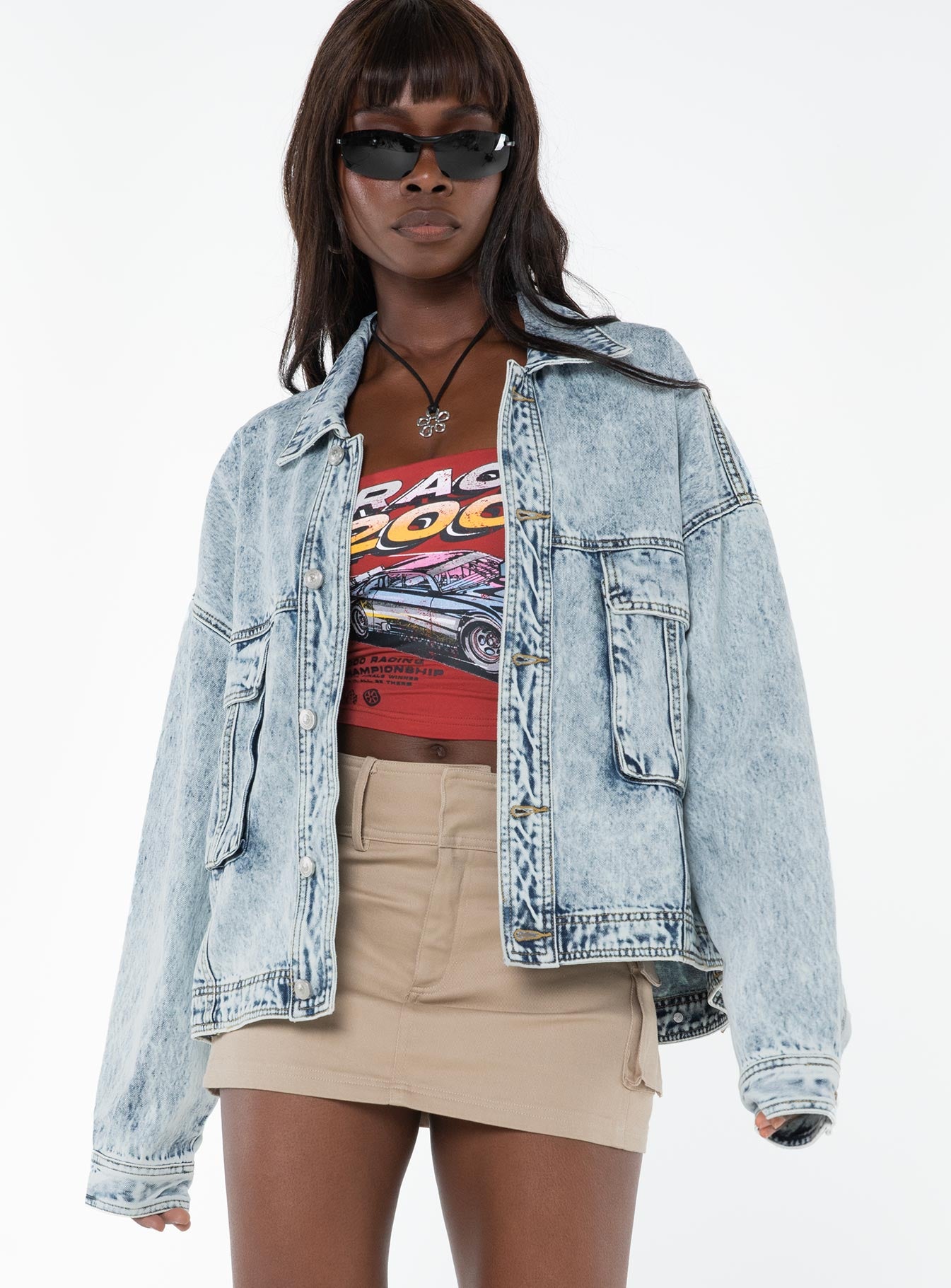 Oversized light wash denim jacket  Classic collar, drop shoulder, button fastening at front, oversized chest pocket, single button cuff