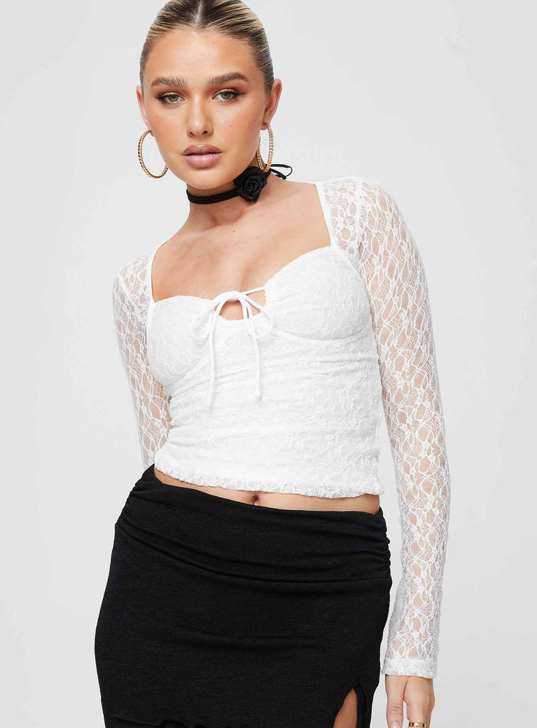 Long sleeve lace top Sweetheart neckline, tie fastening, keyhole cut out, flared cuff Good stretch, partially lined