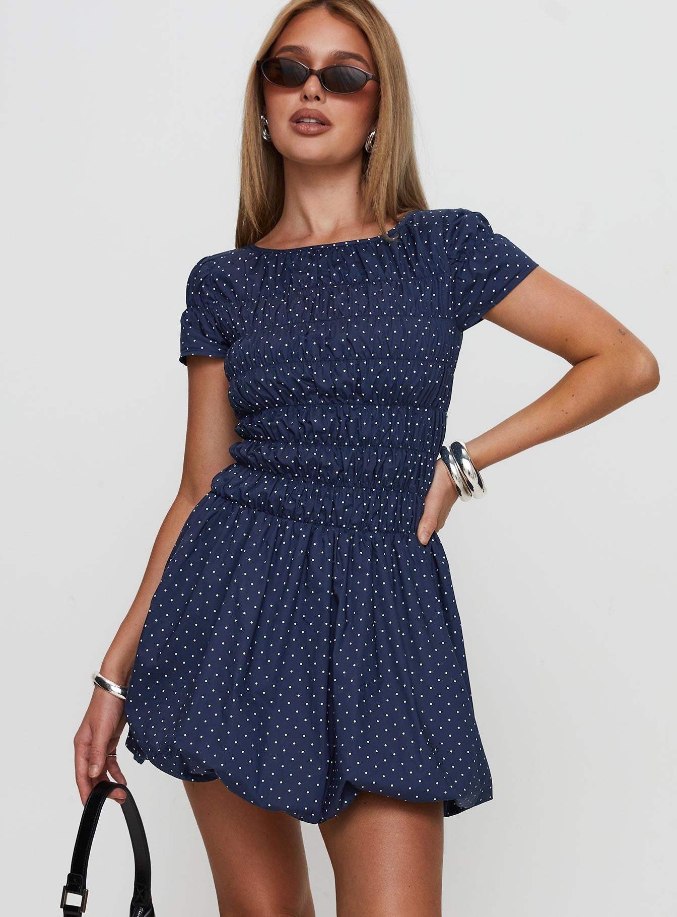 front view of model wearing Princess Polly Kennedia Shirred Bubble Hem Mini Dress Navy Boat Neck 