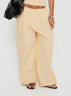side view of model wearing Princess Polly Tidekiss Pants Lemontini Mid Rise Pants 