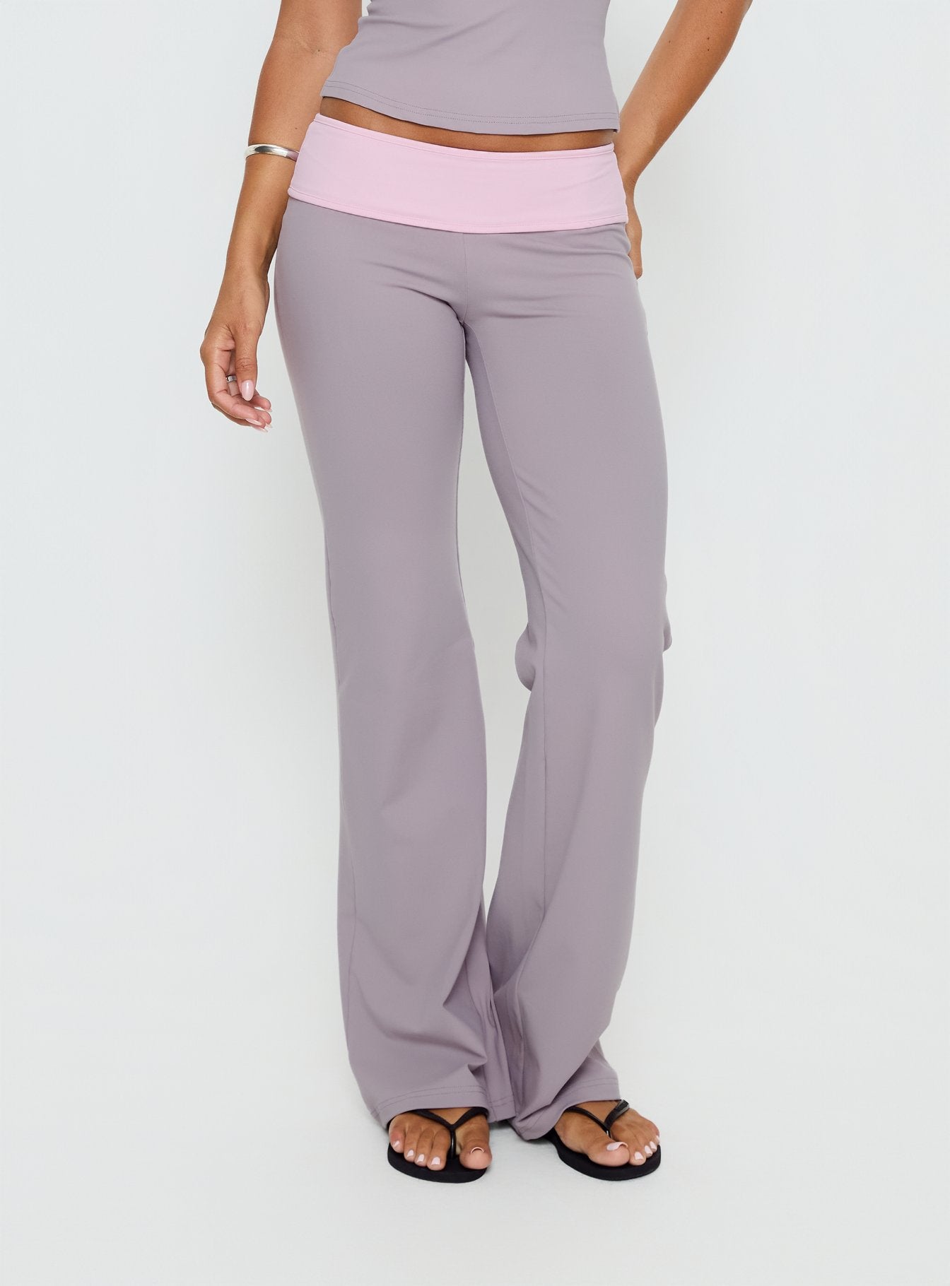 back view of model wearing Princess Polly Kobee Jersey Flare Pants Slate / Dusty Pink Mid Rise Pants 