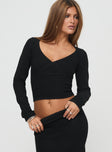 front view of model wearing Princess Polly Memi Long Sleeve Top Black Full Sleeves V-Neck 