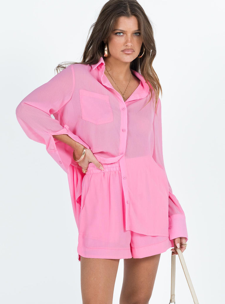 Pink matching set Long sleeve shirt Classic collar Button fastening at front Single chest pocket Shorts Thick elasticated waistband Twin hip pockets