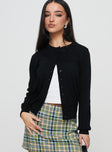 side view of model wearing Princess Polly Capeside Knit Cardigan Black Cropped 