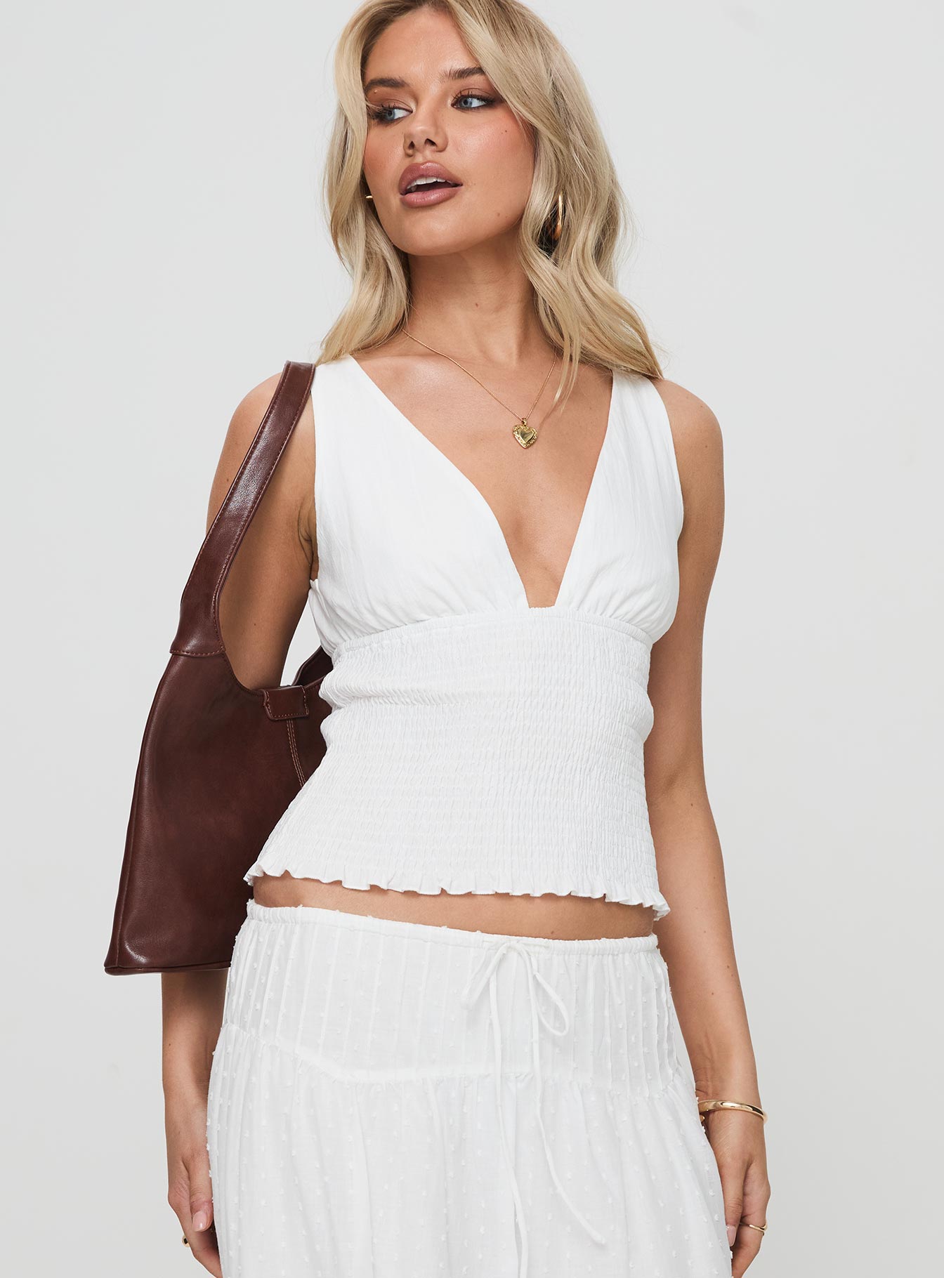 front view of model wearing Princess Polly Barletta Top White Sleeveless Plunger 