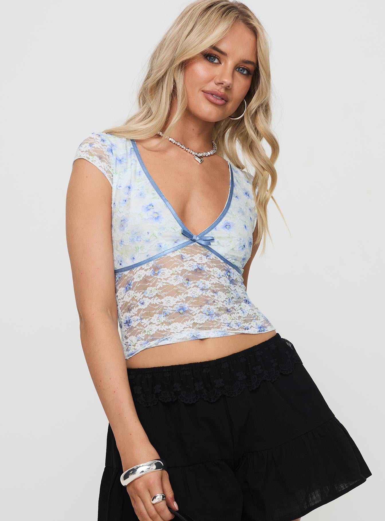 side view of model wearing Princess Polly Ocotillo Top White Short Sleeves Plunger 