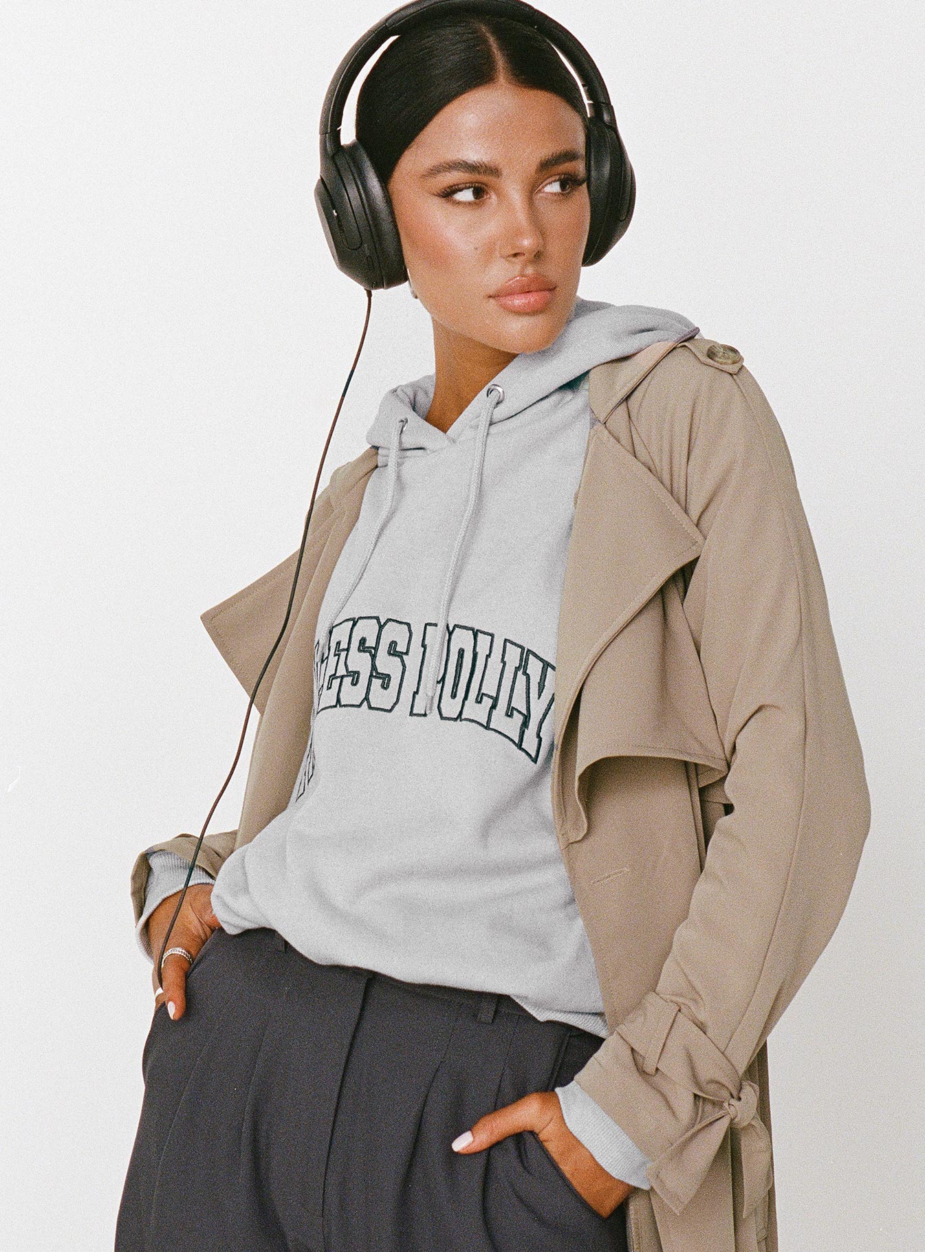 side view of model wearing Princess Polly Princess Polly Hooded Sweatshirt Collegiate Text Grey / Green 