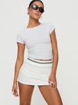 front view of model wearing Princess Polly Emberia Skort White High Waisted Shorts 