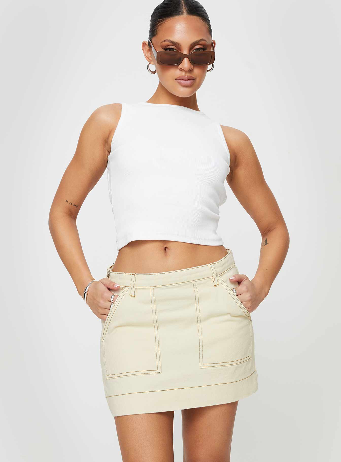   front view of model wearing Princess Polly Hughes Mini Skirt Cream Denim Mini Skirts 