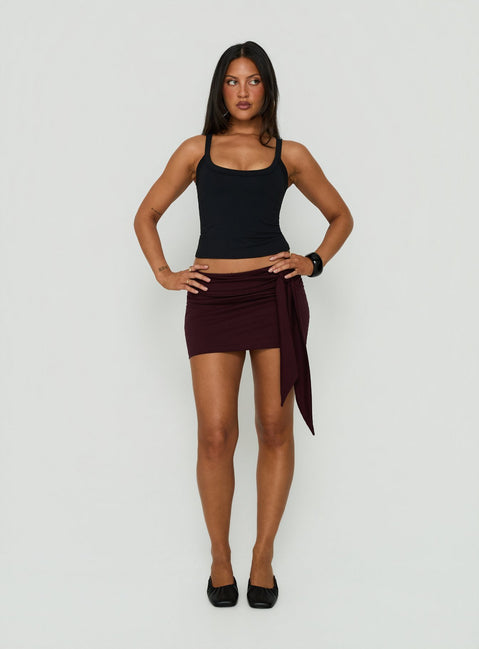 Showcasing the Eldric Tie Waist Micro Skirt Aubergine womens-skirts in mini length product