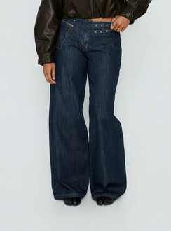 back view of model wearing Princess Polly Paltrow Mid Rise Wide Leg Cargo Jeans Dark Blue Wash Mid Rise Jeans 