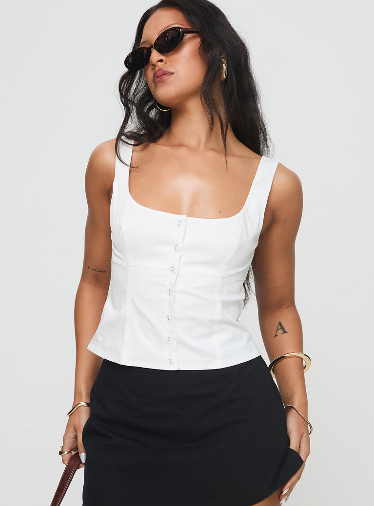 side view of model wearing Princess Polly Effortless Top White Sleeveless Scoop Neck 