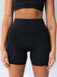 Black active shorts  Featuring a high waisted design and twin slip leg pockets