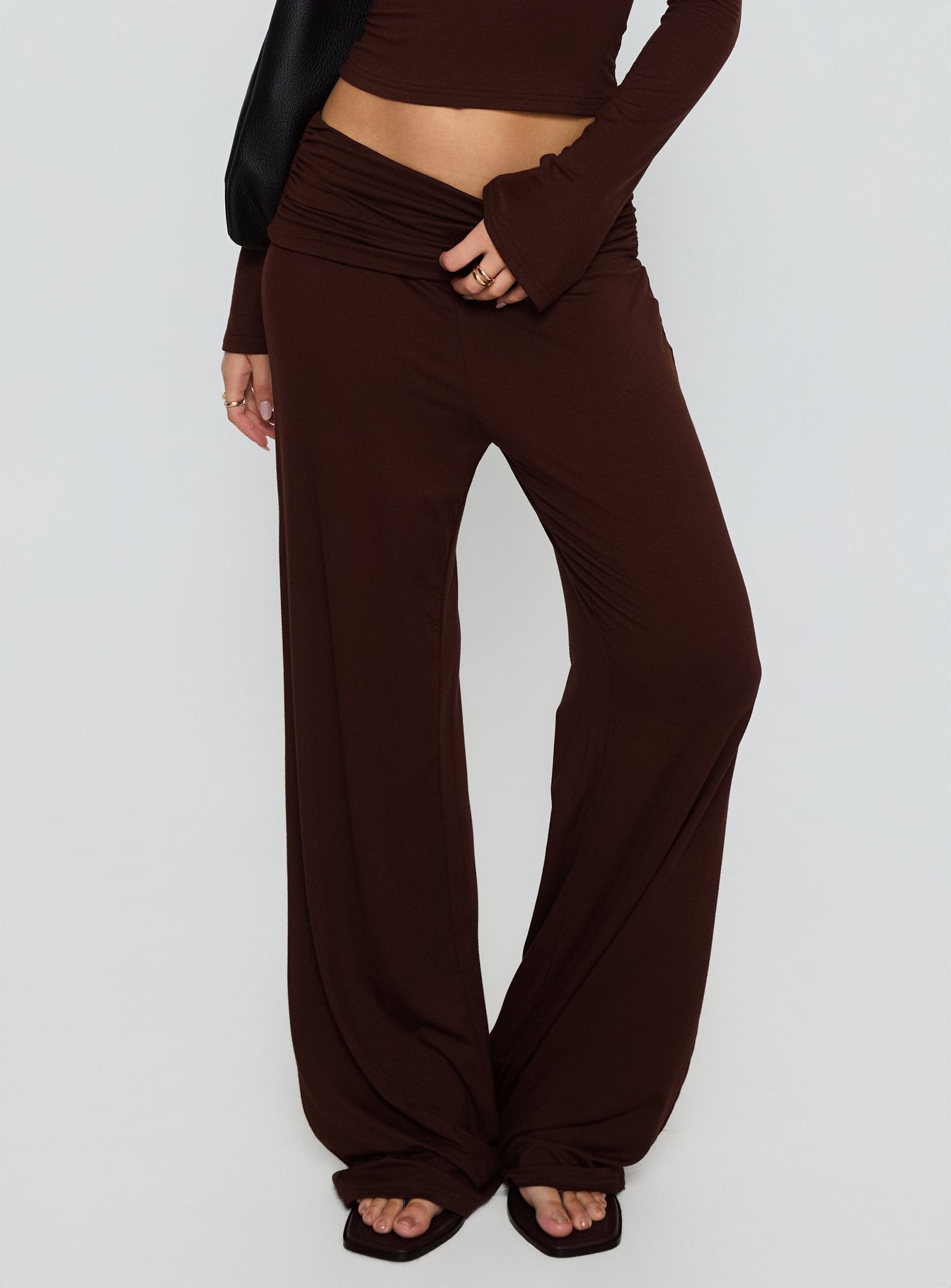 side view of model wearing Princess Polly Fawne Ruched Folded Pants Brown Mid Rise Pants 