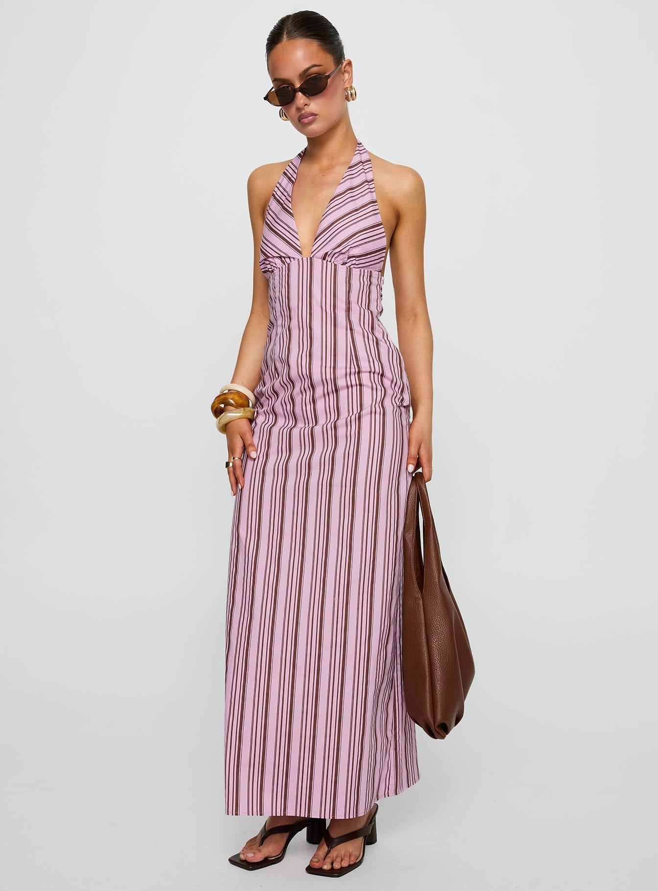 front view of model wearing Princess Polly Avrie Halter Maxi Dress Pink / Brown Stripe Plunger 