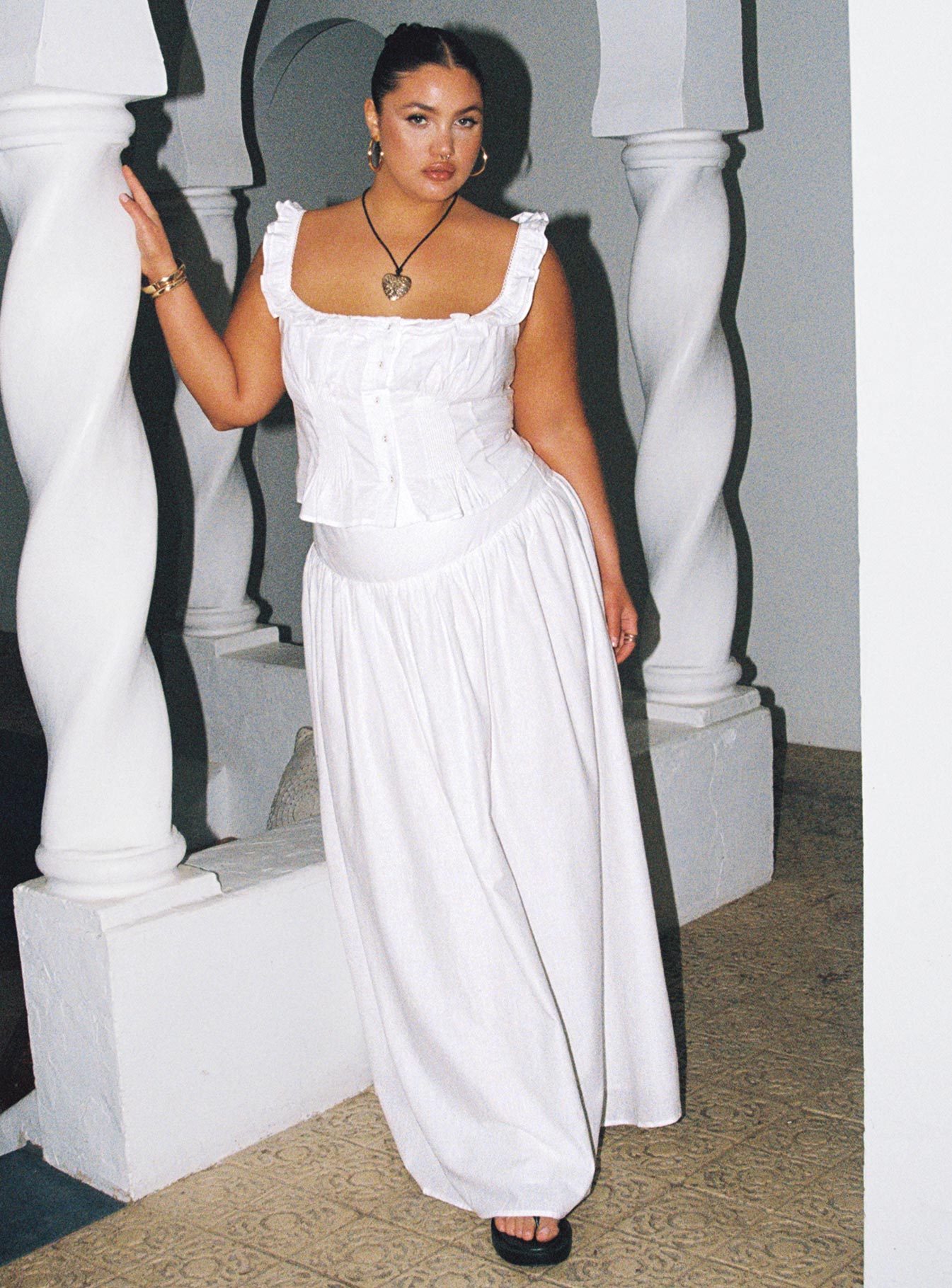   side view of model wearing Princess Polly Valerio Maxi Skirt White Curve Maxi 