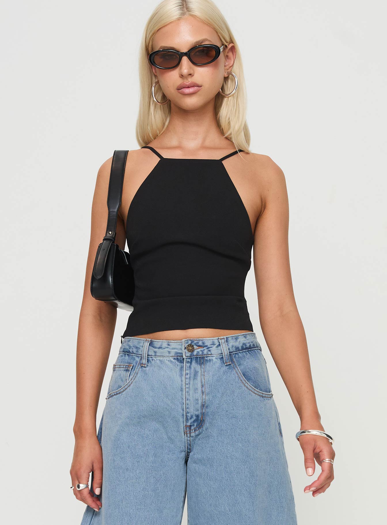 front view of model wearing Princess Polly Arianwen Top Black Sleeveless Crew Neck 