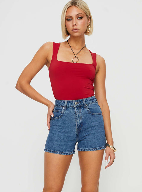 Mid-wash denim shorts High rise, belt looped waist, zip and button fastening, five pockets,  branded patch at back Non-stretch material, unlined 