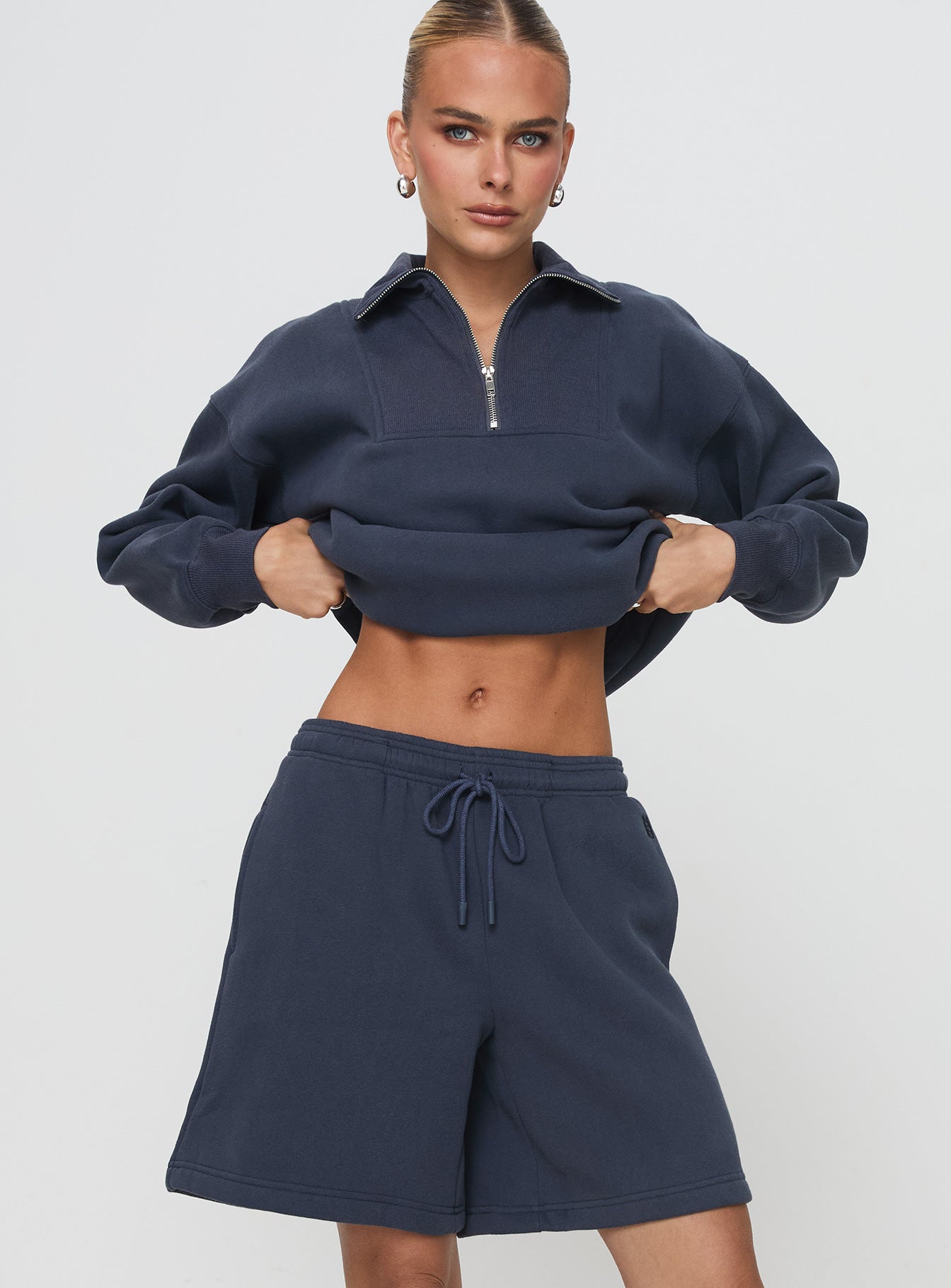 front view of model wearing Princess Polly Dream Fleece Longline Shorts Navy High Waisted Shorts 