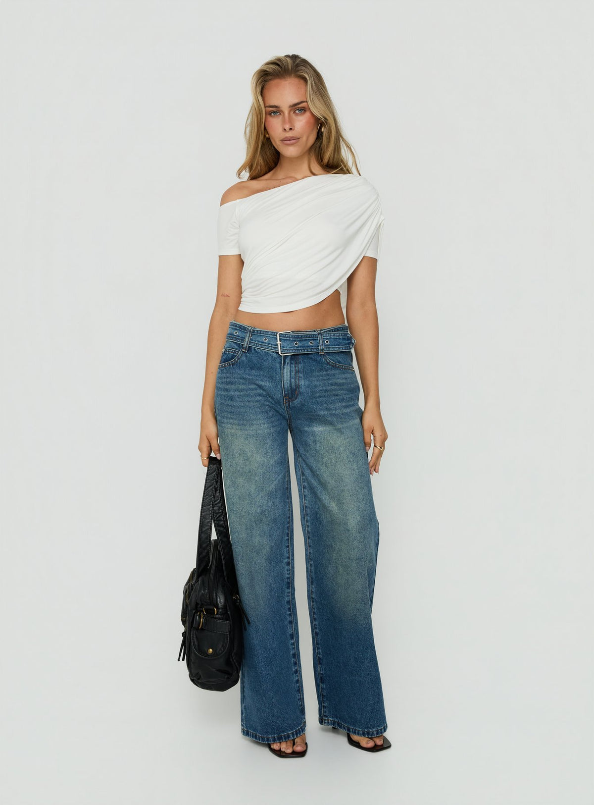 Showcasing Charlotta Low Rise Super Baggy Jeans Mid Blue womens-jeans front view of model wearing Princess Polly