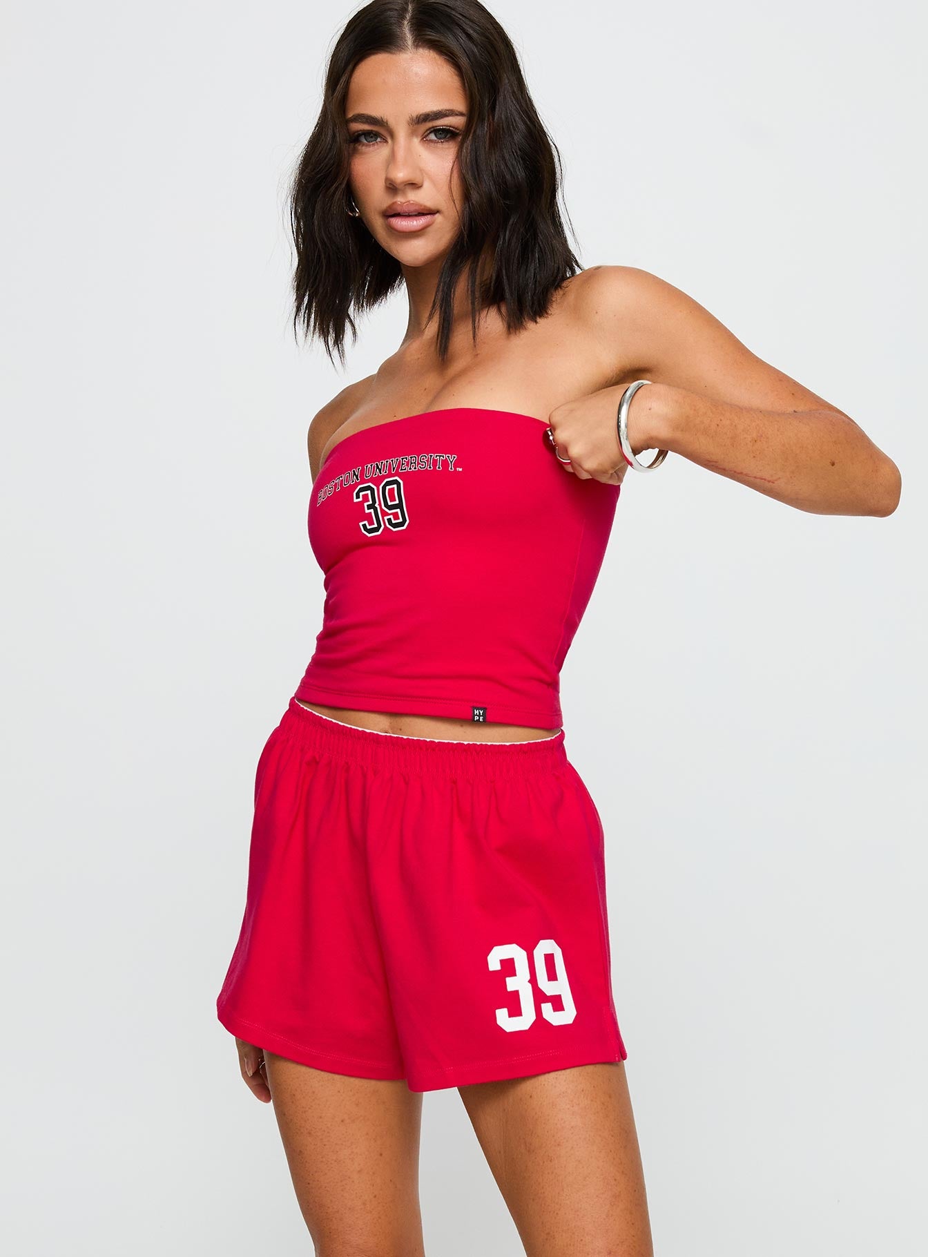 front view of model wearing Princess Polly Boston University Soffee Shorts Red High Waisted Shorts 