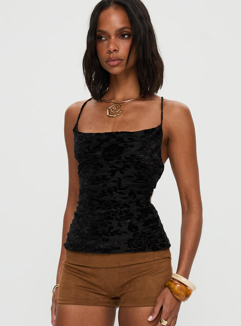 side view of model wearing Princess Polly Celena Halter Top Black Sleeveless Cowl 