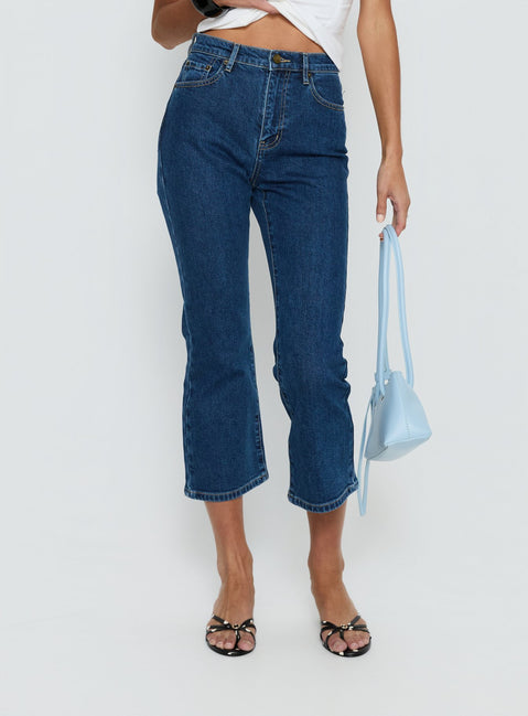 side view of model wearing Princess Polly Cindee High Rise Cropped Jeans Mid Blue Wash High Rise Jeans 
