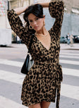 front view of model wearing Princess Polly Raquela Wrap Mini Dress Leopard V-Neck 