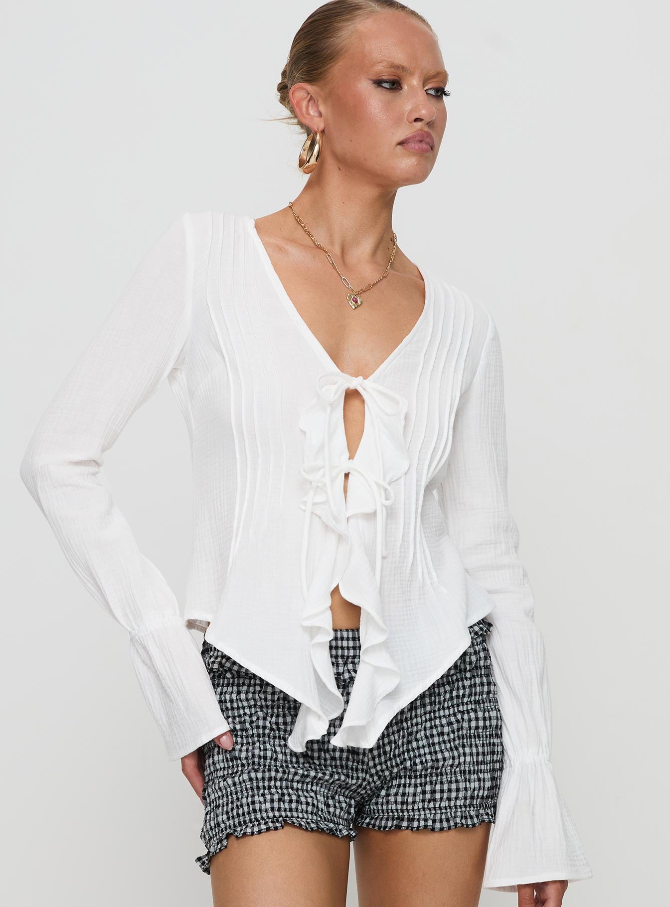 white ruffle long sleeve shirt