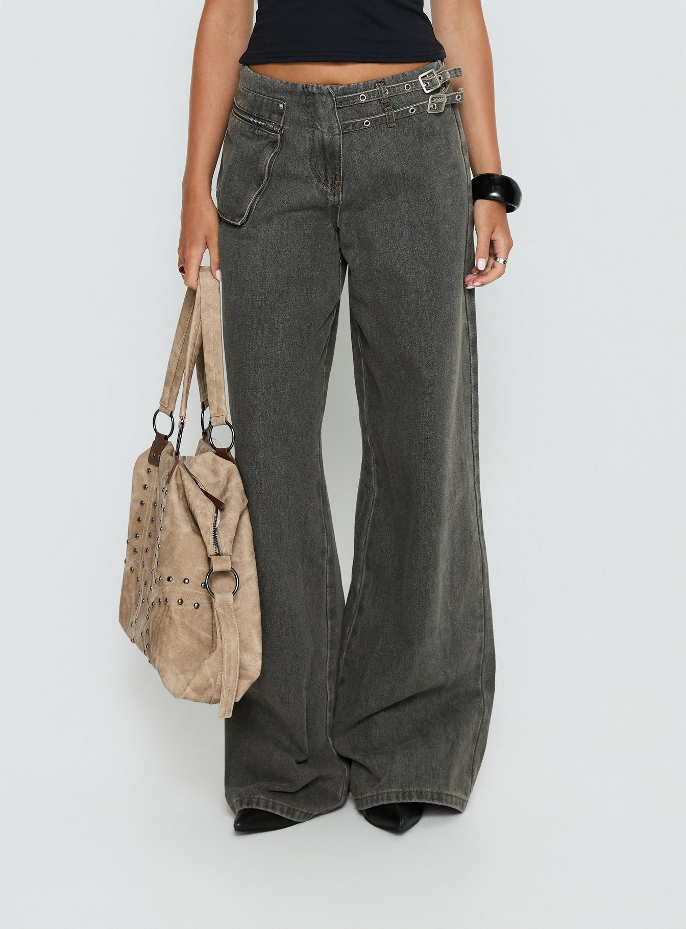 back view of model wearing Princess Polly Paltrow Mid Rise Wide Leg Cargo Jeans Washed Grey Mid Rise Jeans 