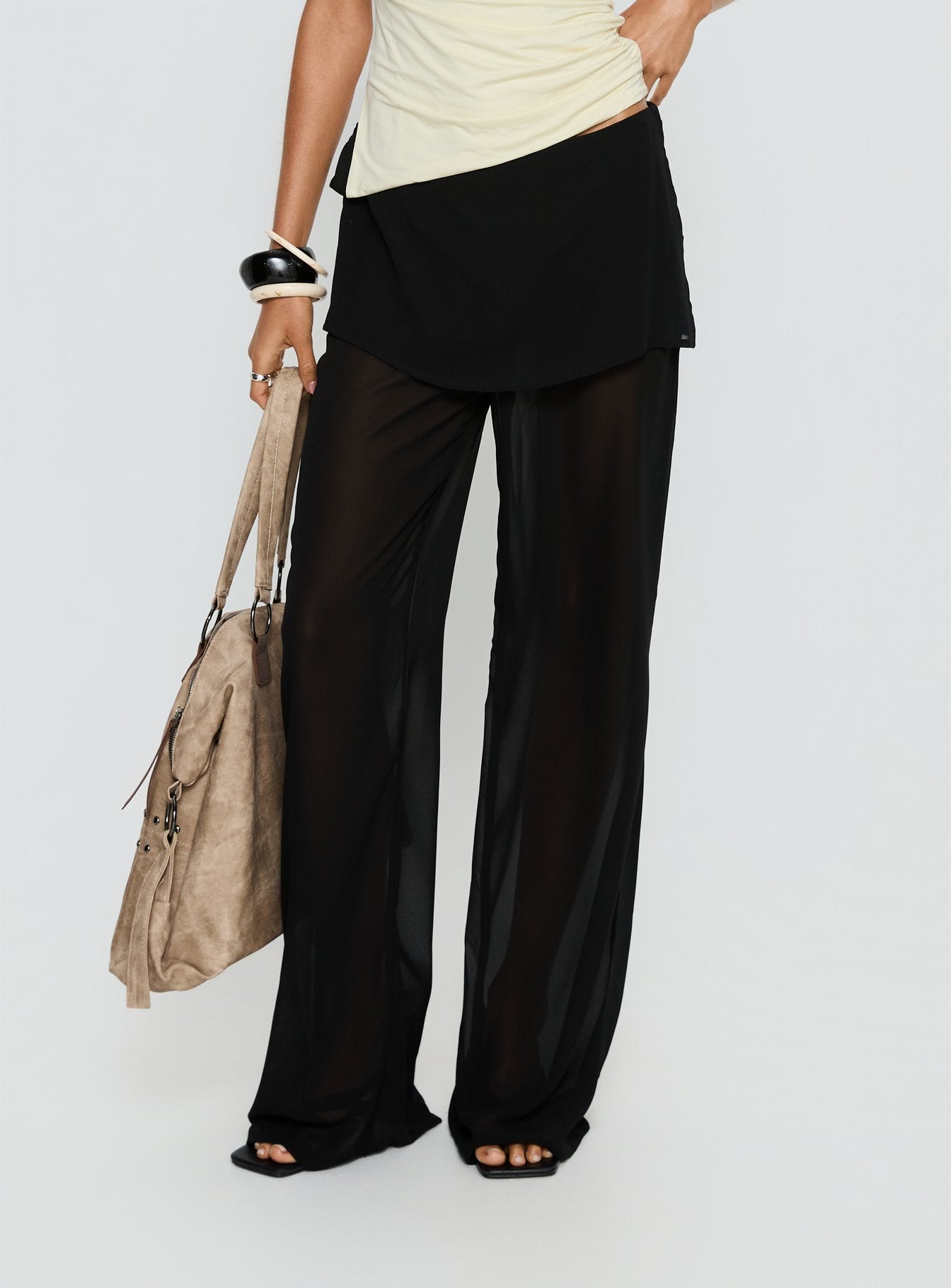 side view of model wearing Princess Polly Jaedon Chiffon Layered Pants Black Mid Rise Pants 