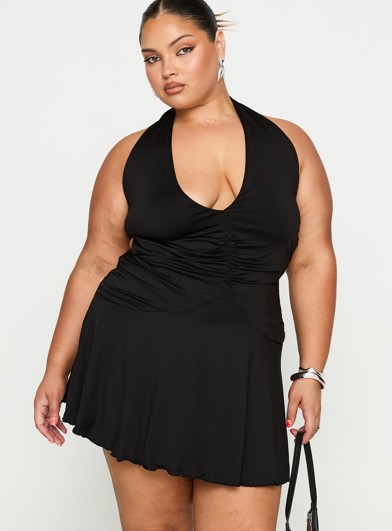 front view of model wearing Princess Polly Maeva Halter Mini Dress Black Curve Plunger 