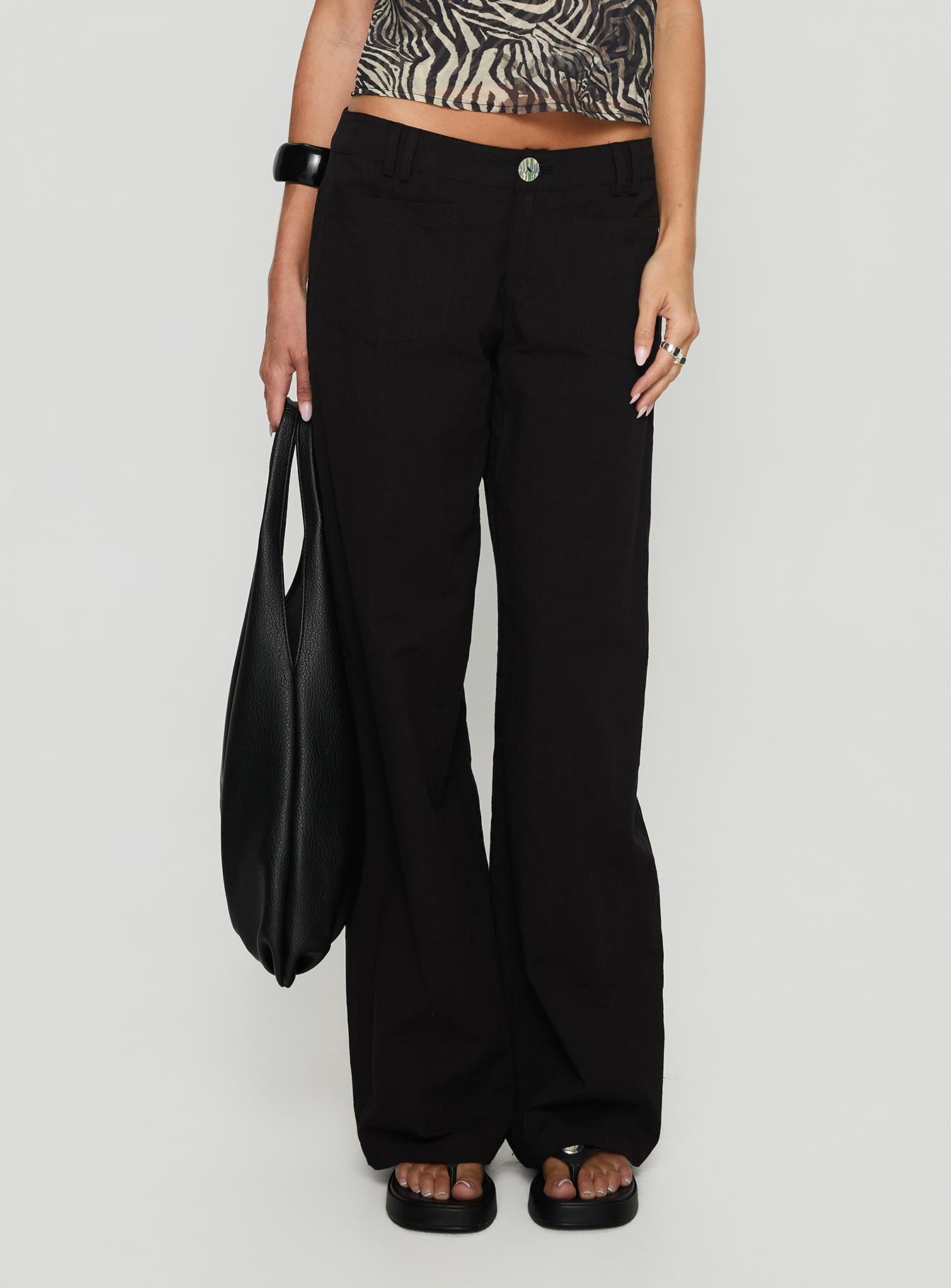 front view of model wearing Princess Polly Vendi Low Rise Pant Black Low Rise Pants 