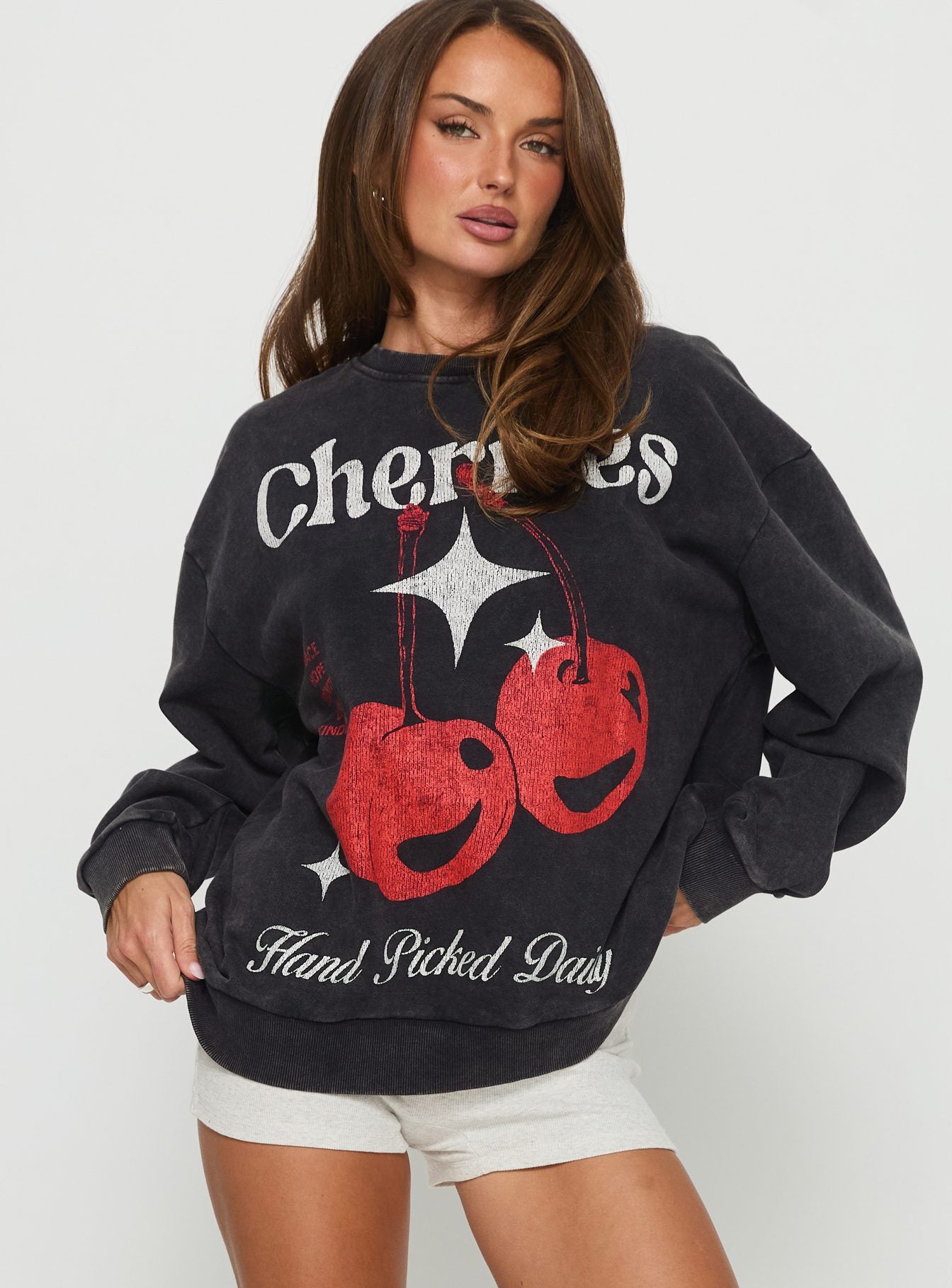 front view of model wearing Princess Polly Hand Picked Graphic Jumper Black 