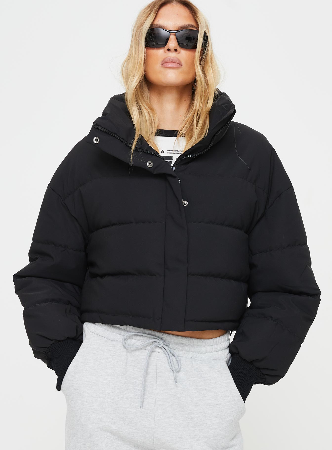 Puffer jacket Snap button fastening at front, mock neck, ribbed cuffs, adjustable drawstring around waist Non-stretch, fully lined Princess Polly Lower Impact 