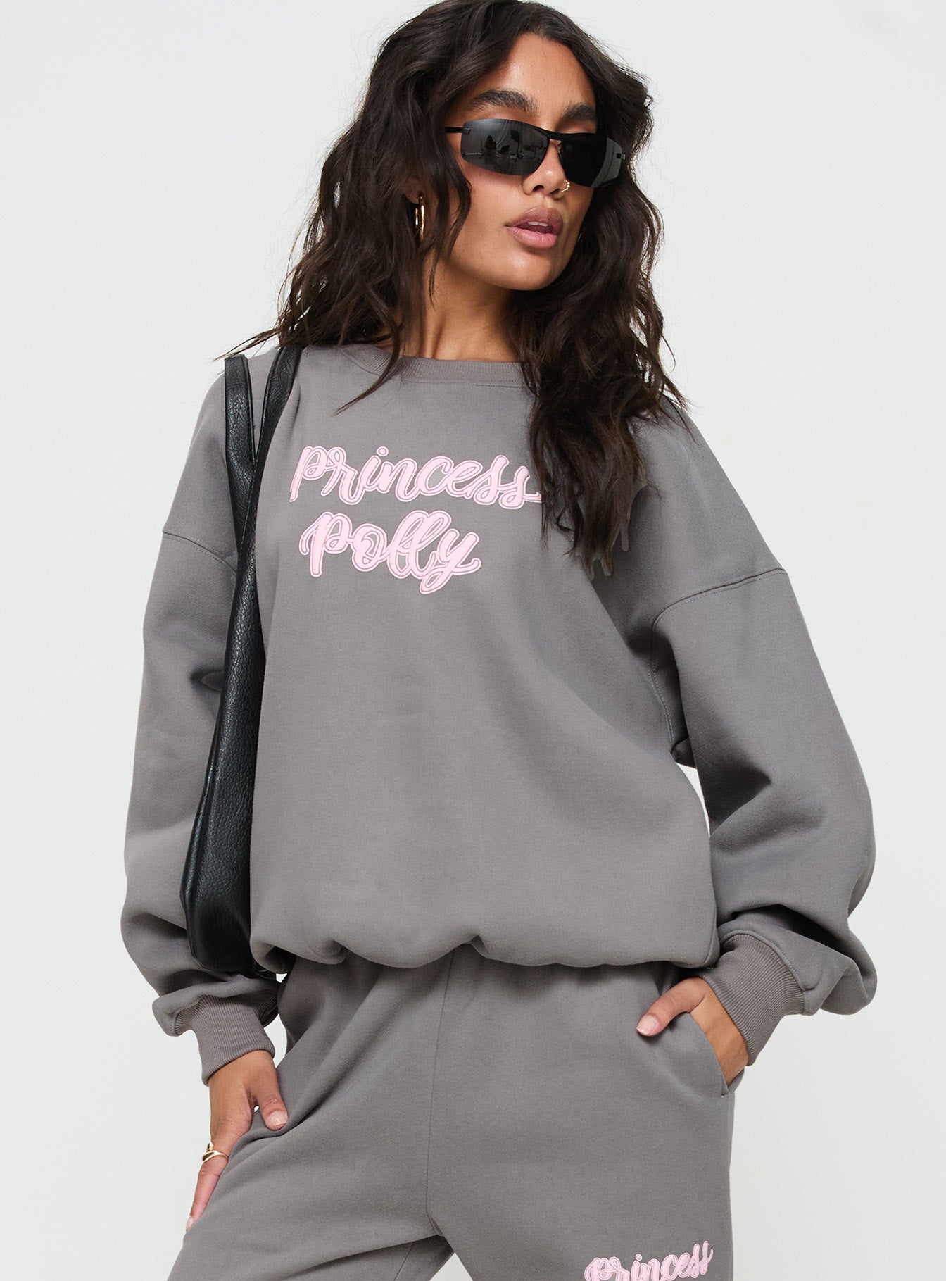 front view of model wearing Princess Polly Princess Polly Crew Neck Sweatshirt Puff Text Charcoal Long 