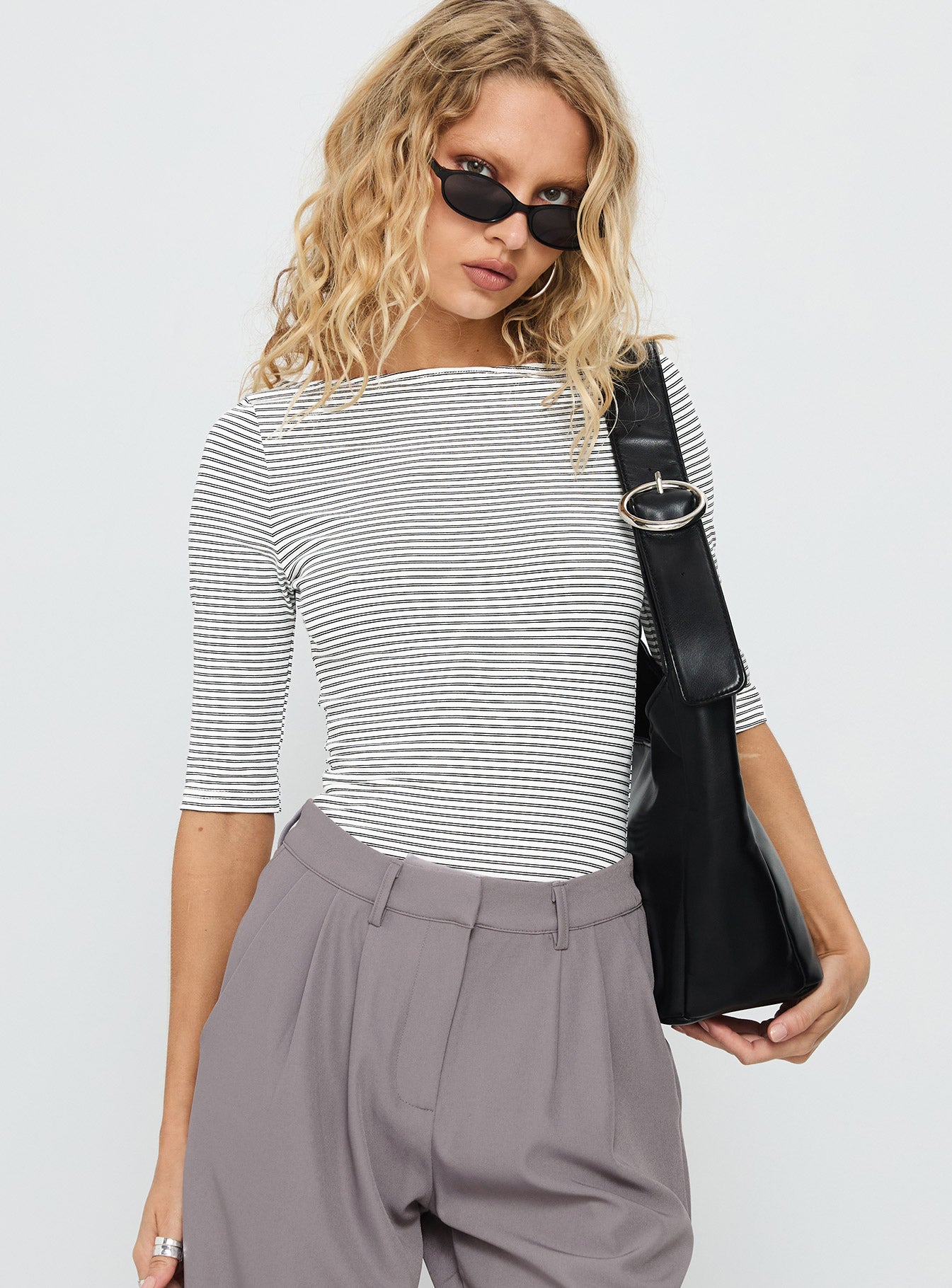 front view of model wearing Princess Polly Here One Moment 3/4 Sleeve Bodysuit Black / White Stripe Half Sleeve 