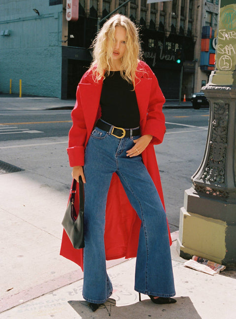 front view of model wearing Princess Polly Lucille High Rise Flare Leg Jeans Mid Wash High Waisted 