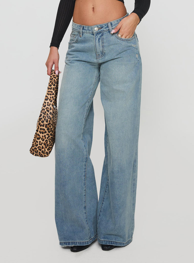 side view of model wearing Princess Polly Demie Distressed Detail Wide Leg Jean Light Wash Low Rise Jeans 