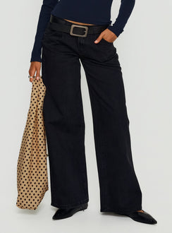 side view of model wearing Princess Polly Supercut Low Rise Baggy Pleat Jeans Washed Black Low Rise Jeans 