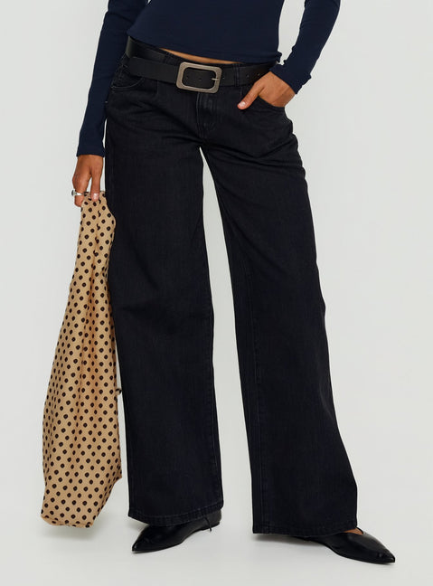 side view of model wearing Princess Polly Supercut Low Rise Baggy Pleat Jeans Washed Black Low Rise Jeans 
