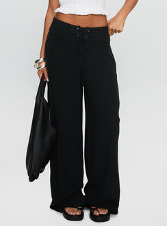side view of model wearing Princess Polly Raymonde Pants Black High Waisted Pants 