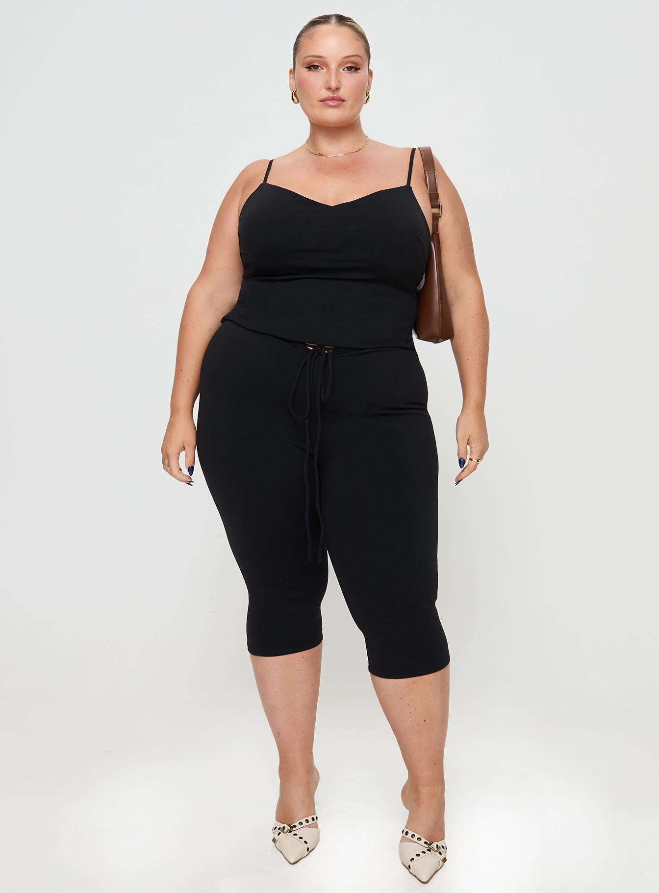 side view of model wearing Princess Polly Gisella Pants Black Curve High Waisted Pants 