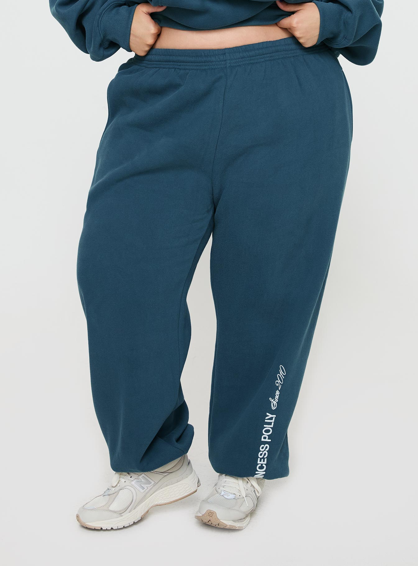 Princess polly track pants block / cursive text slate curve