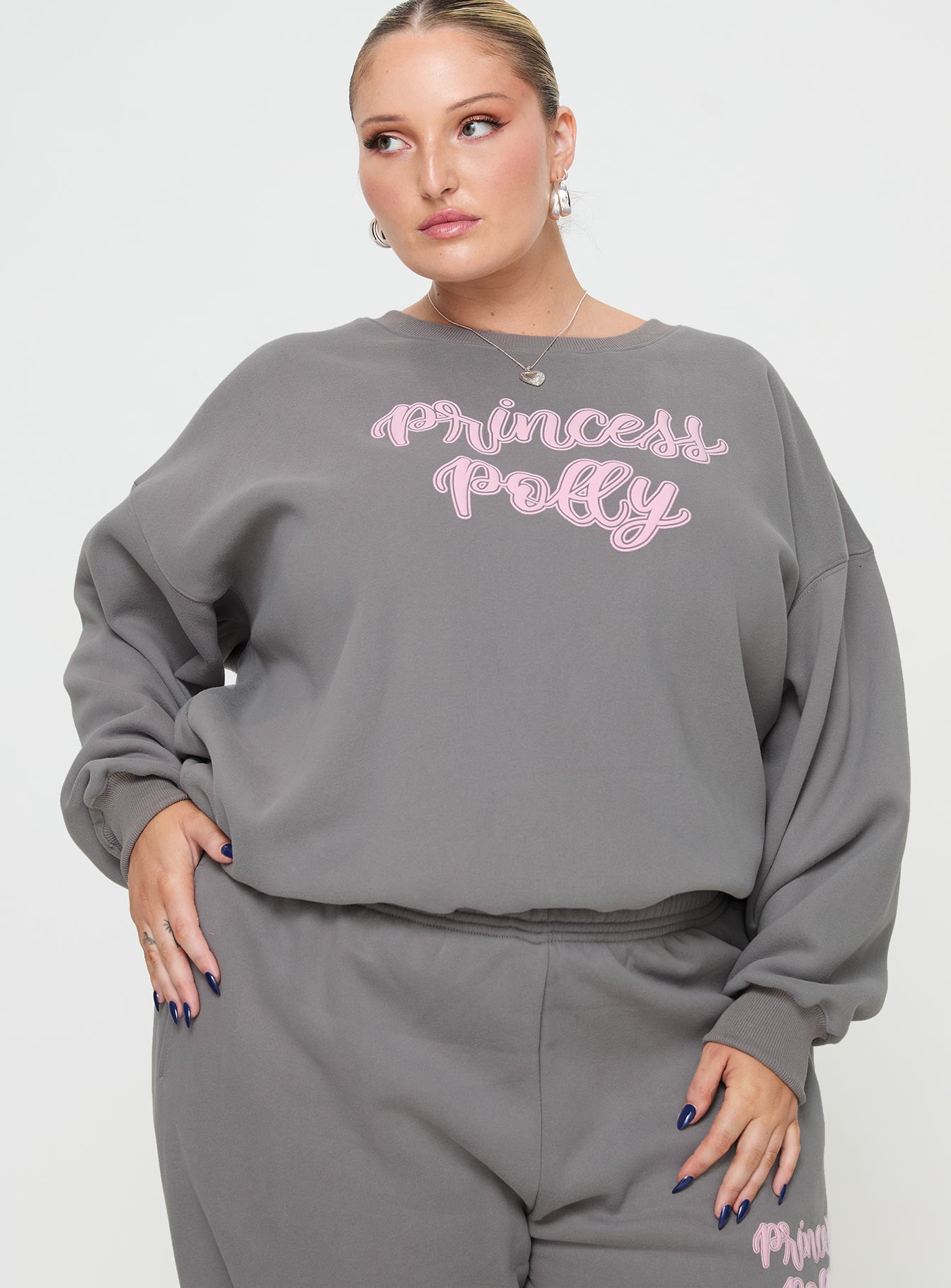front view of model wearing Princess Polly Princess Polly Crew Neck Sweatshirt Puff Text Charcoal Curve 