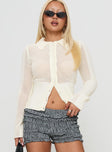 front view of model wearing Princess Polly Ethanne Knit Cardigan Cream Cropped 