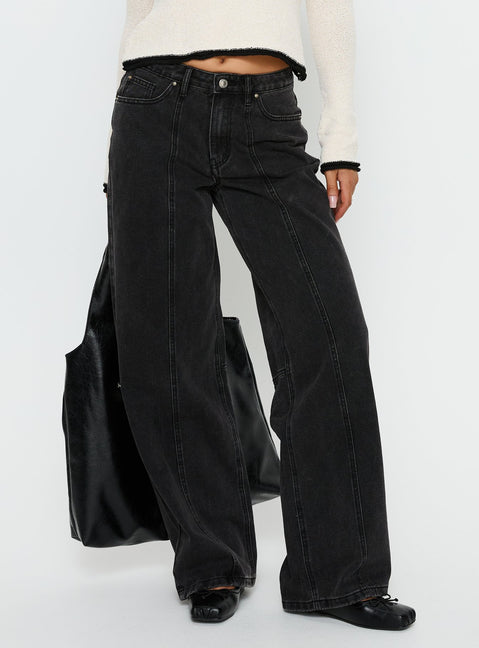 side view of model wearing Princess Polly Lando Low Rise Straight Leg Jeans Washed Black Low Rise Jeans 