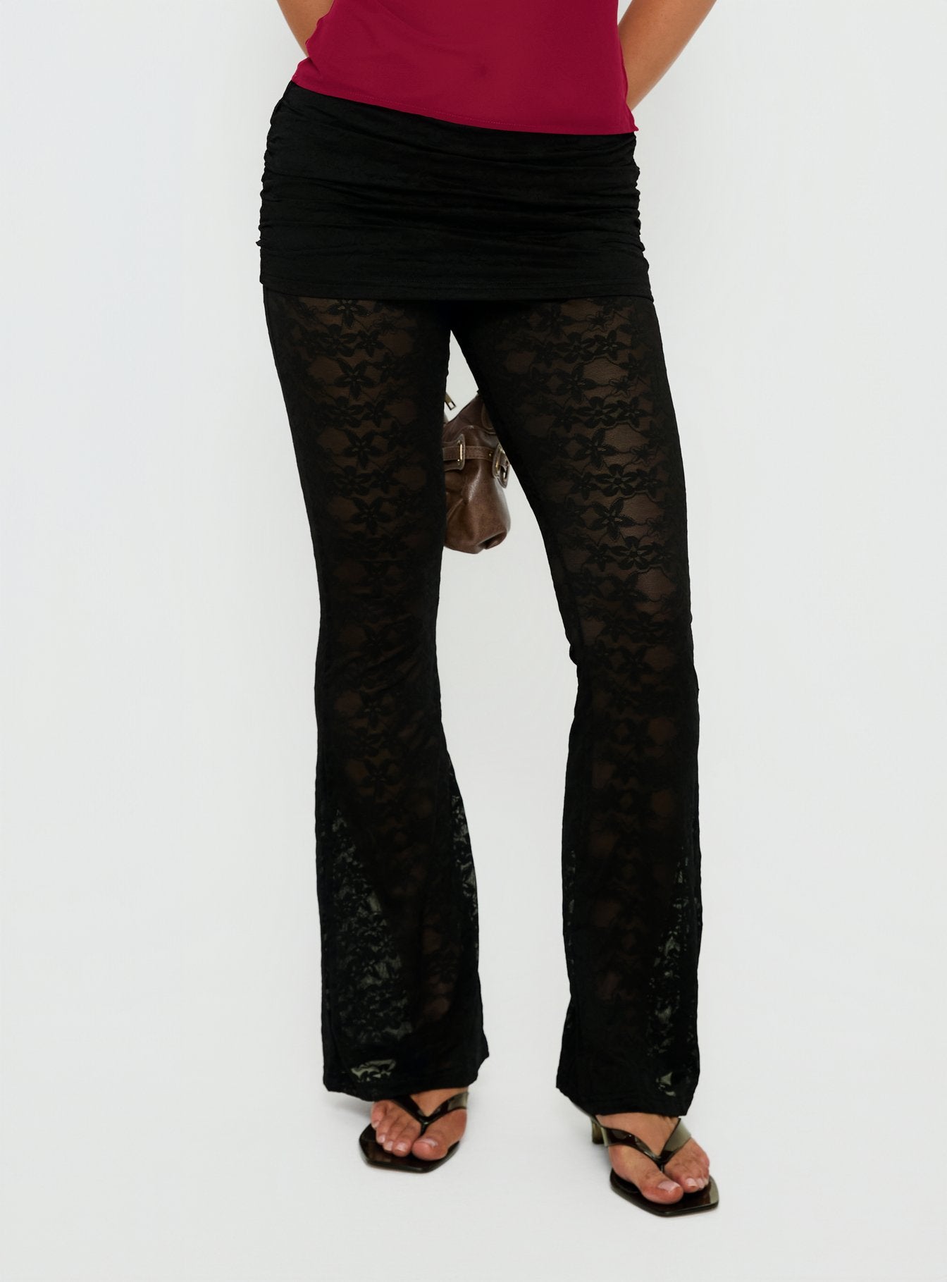 side view of model wearing Princess Polly Gogo Lace Flare Pants Black Mid Rise Pants 
