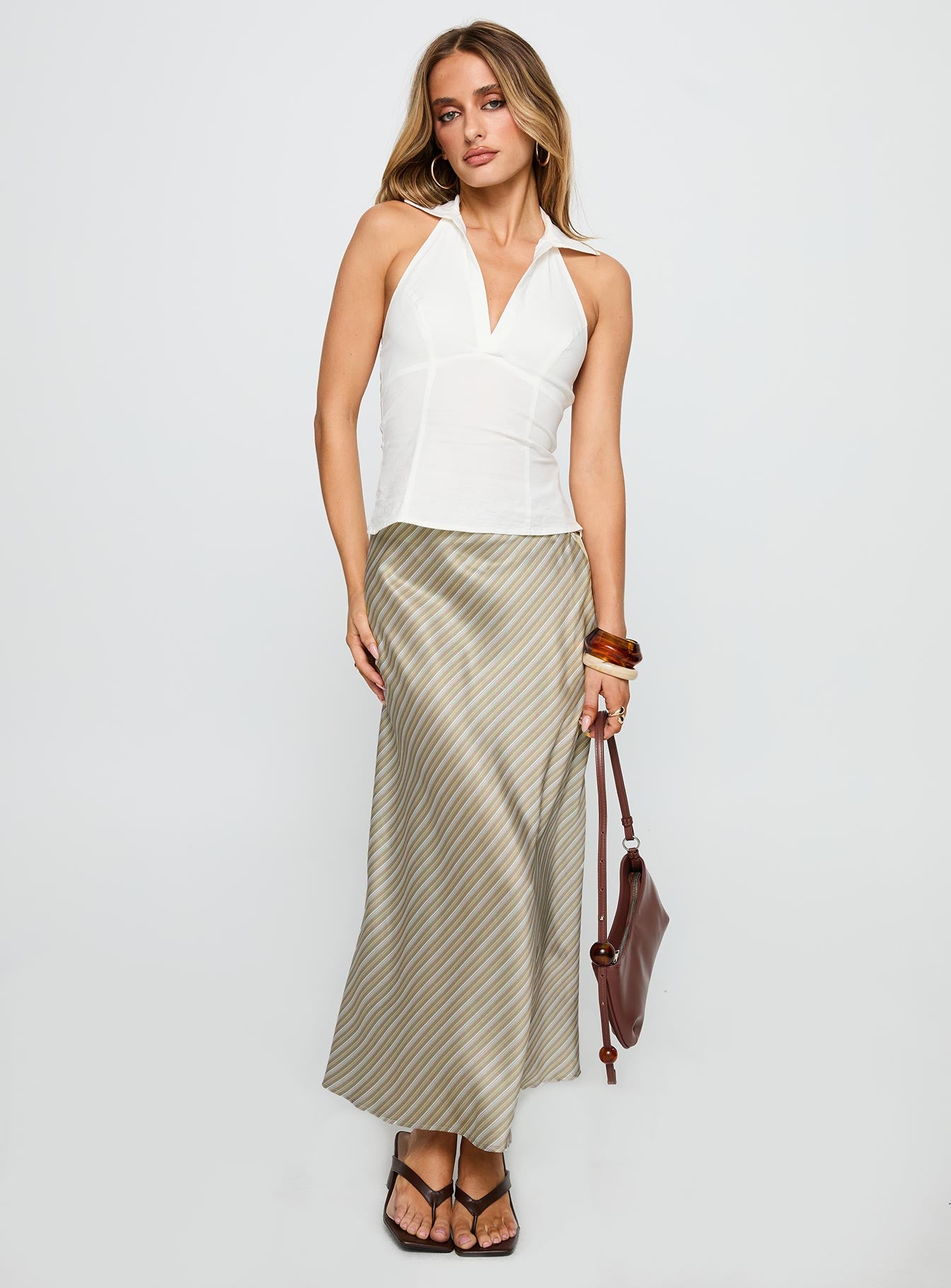   side view of model wearing Princess Polly Mixed Signals Midi Skirt Brown Stripe Midi Skirts 