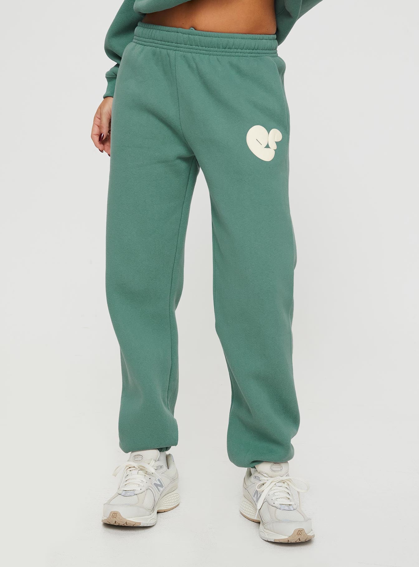 Princess polly track pants bubble text sage / eggshell